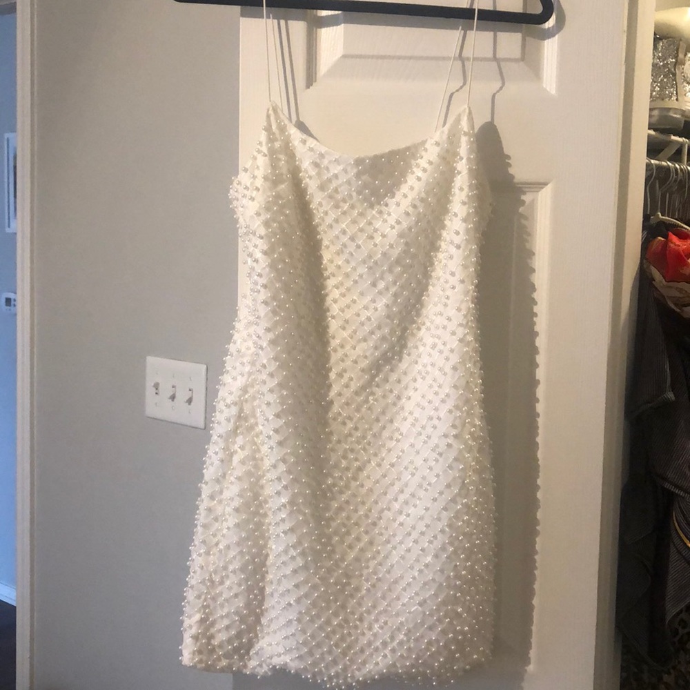 White mini dress with pearls